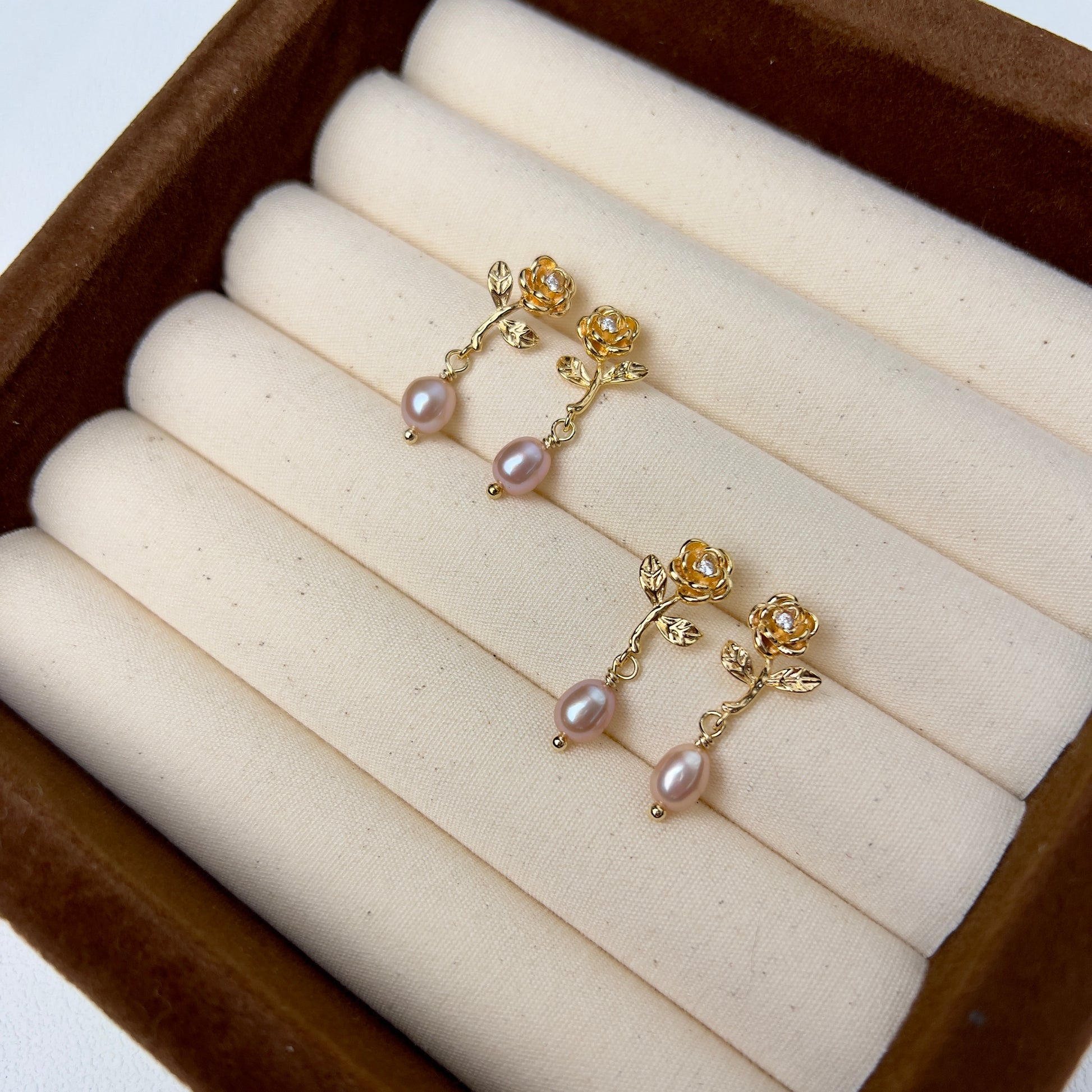 Rose-shaped earrings, Gold-plated studs, Silver jewelry, Natural pearl drops, Timeless elegance, Sophisticated allure, Wearable masterpieces, Impeccable craftsmanship, Luxury earrings, Statement jewelry