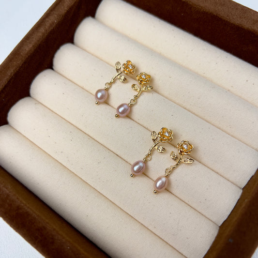 Rose-shaped earrings, Gold-plated studs, Silver jewelry, Natural pearl drops, Timeless elegance, Sophisticated allure, Wearable masterpieces, Impeccable craftsmanship, Luxury earrings, Statement jewelry